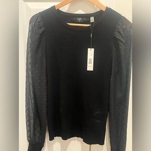Black tahari sweater with see through sleeves with sparkling polka dots. NWT